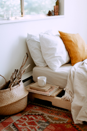 Testing, Testing, Testing Sunny bedroom with coffee, books, pillows and basket of sticks